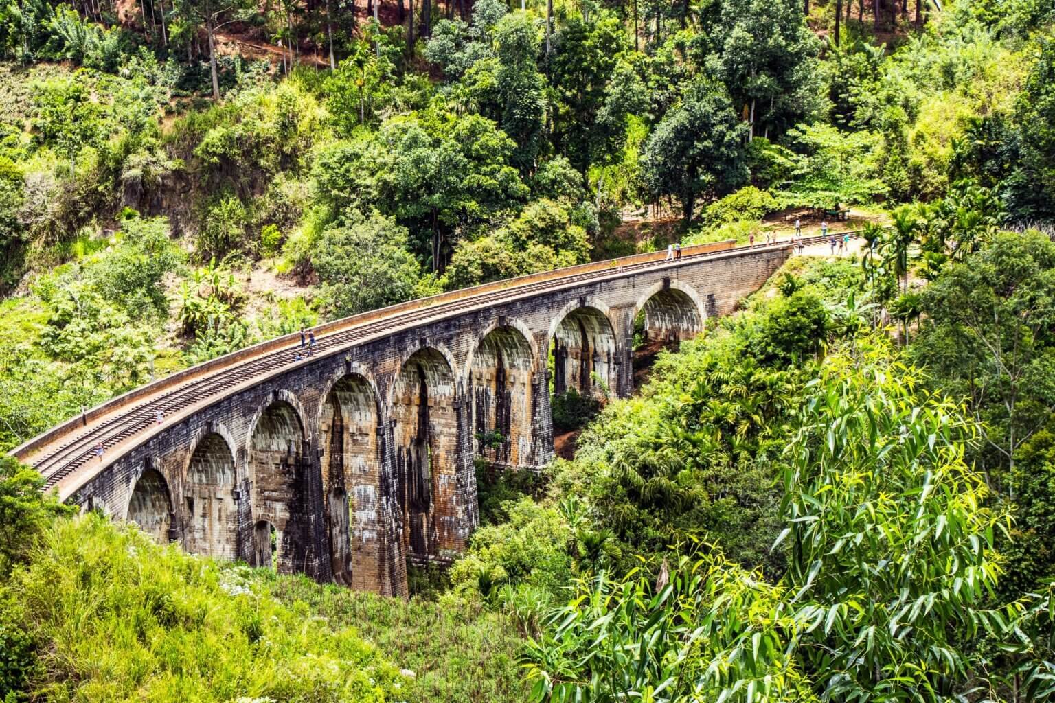 Discover the lush greenery and iconic Nine Arches Bridge in Demodara, Sri Lanka.